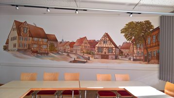 Wandgemälde im Adam-Schmitt-Saal (historische Ansicht der Dorfmitte)